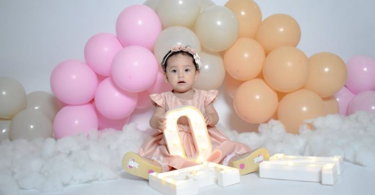 Balloon Arch - Baby Sitting under Balloon Arch Holding Letter Shaped Lamp