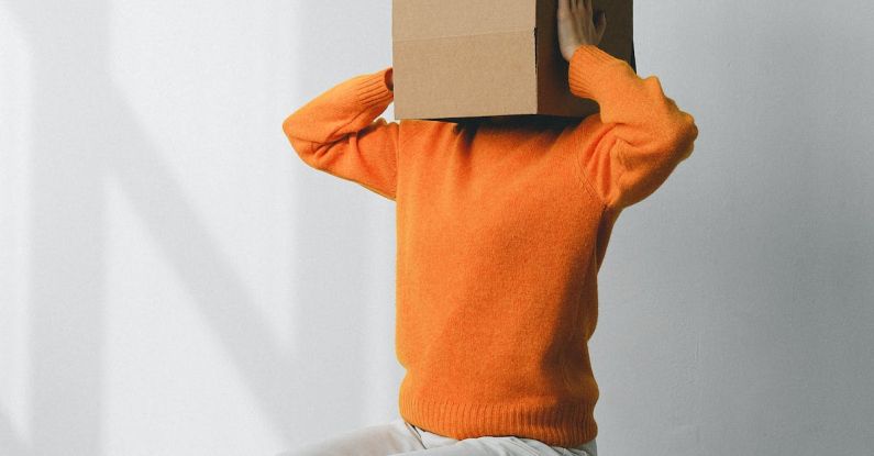 Memory Box - Crop anonymous person putting creased paper with Rubbish inscription in container with Brain title on head of female on chair