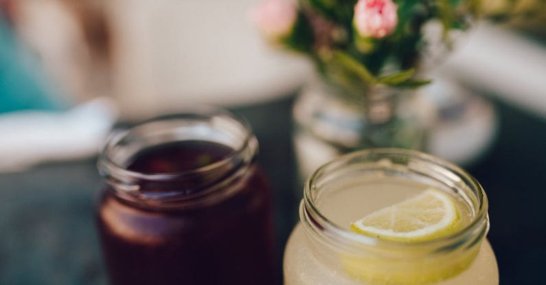 Mason Jars - Clear Glass Mason Jar With Lemon Slice on Top of Cocktail