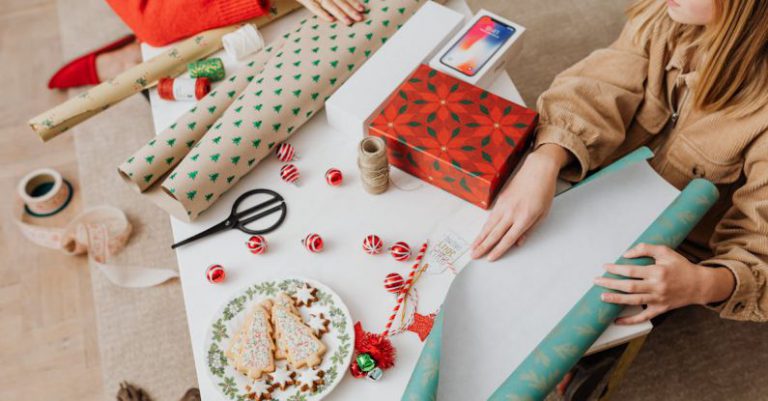 Handmade Ornaments - Woman in Brown Jacket Holding Green and White Wrapping Paper