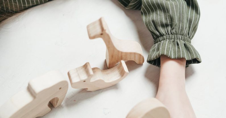 Crafts For Toddlers - Girl Holding a Wooden Octopus