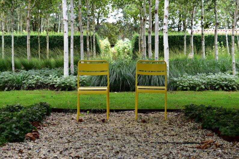 Plan Garden - two yellow chairs in a garden