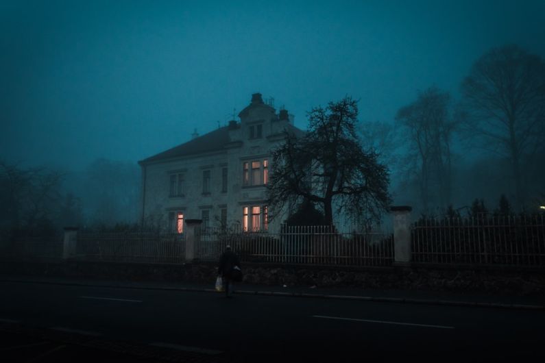 Haunted House - person walking towards house