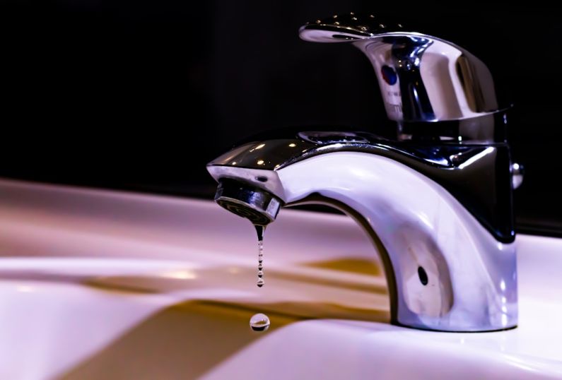 Faucet - stainless steel faucet on white ceramic sink